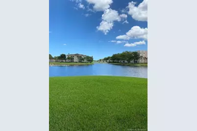 7980 N Nob Hill Rd #102, Tamarac, FL 33321 - Photo 2