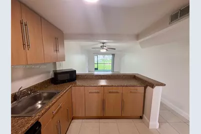 8060 N Colony Cir N #107, Tamarac, FL 33321 - Photo 2