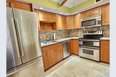 427 Golden Isles Dr #16E, Hallandale Beach, FL 33009 - Photo 4