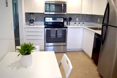 3970 Oaks Clubhouse Dr #306, Pompano Beach, FL 33069 - Photo 1