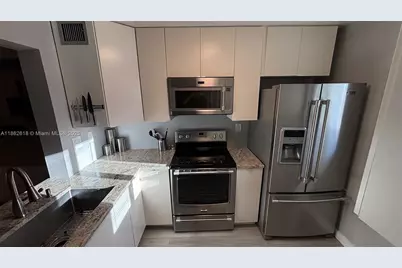 2761 S Oakland Forest Dr #103, Oakland Park, FL 33309 - Photo 1