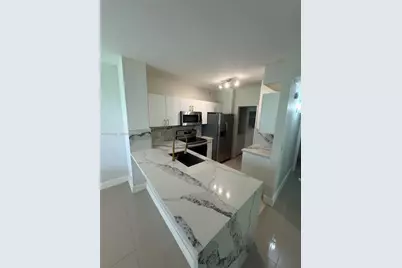 8000 N Nob Hill Rd #101, Tamarac, FL 33321 - Photo 1