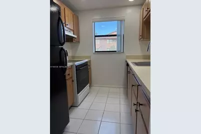 10057 Winding Lake Rd #102, Sunrise, FL 33351 - Photo 1